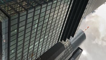 Black and grey skyscraper that rises into the sky